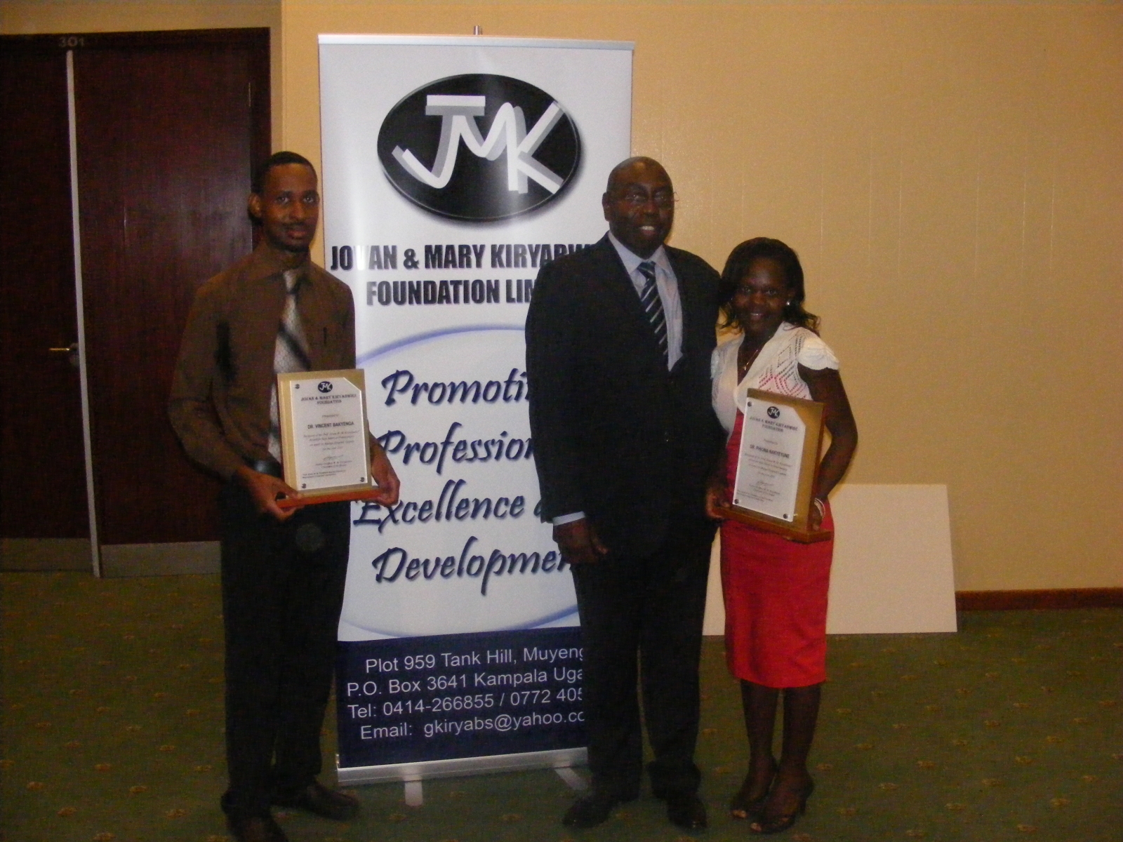 Handing over  JMK awards to Dr Vincent Bakyenga and Dr Phiona Nakyeyune as best interns in neurosurgery 2010 & 2011