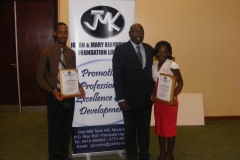 Handing over  JMK awards to Dr Vincent Bakyenga and Dr Phiona Nakyeyune as best interns in neurosurgery 2010 & 2011