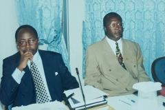 Geoffrey as corporate lawyer presenting paper with Attorney General Bert Katureebe before he became Chief Justice